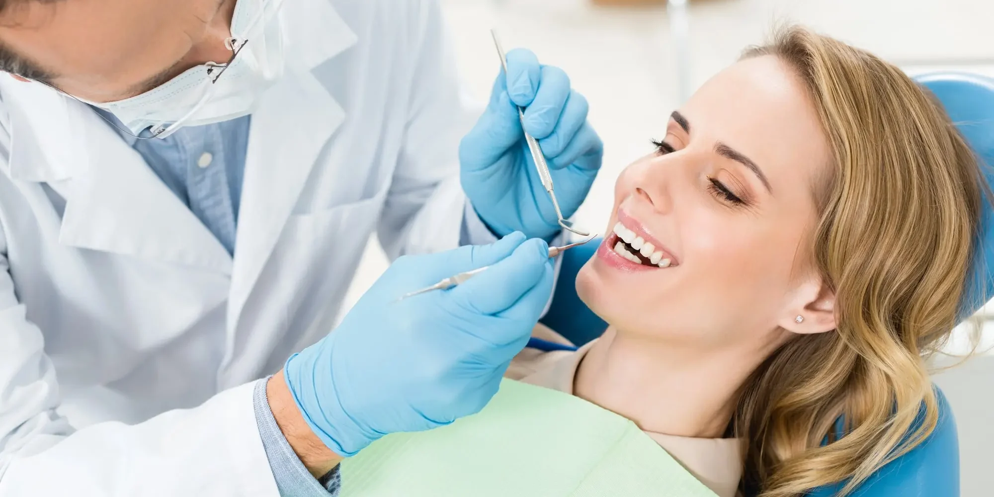 A woman at the dentist getting her teeth checked