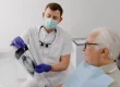 A dentist shows his patient an x-ray