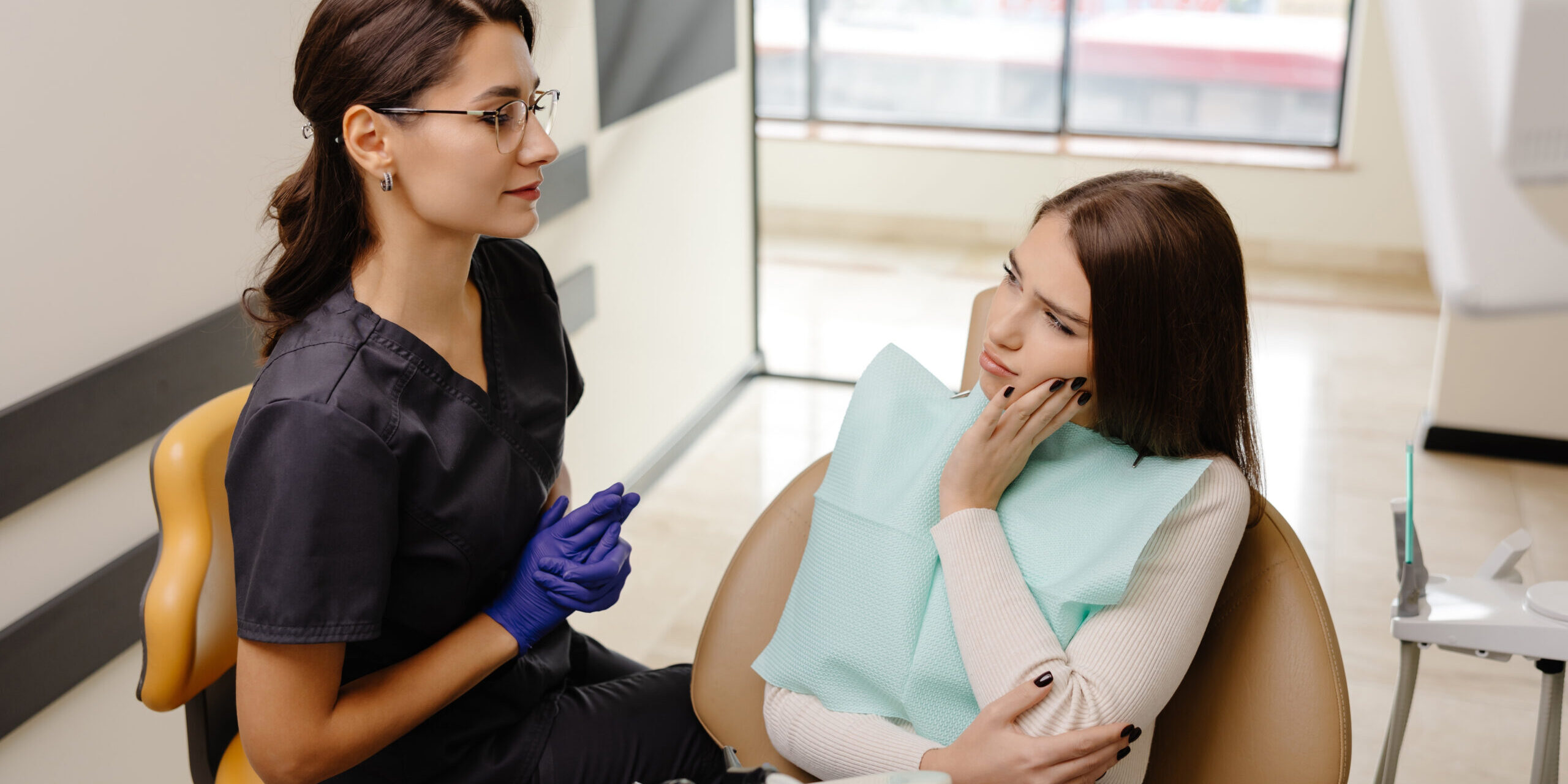 Woman at the dentist for tooth fillings