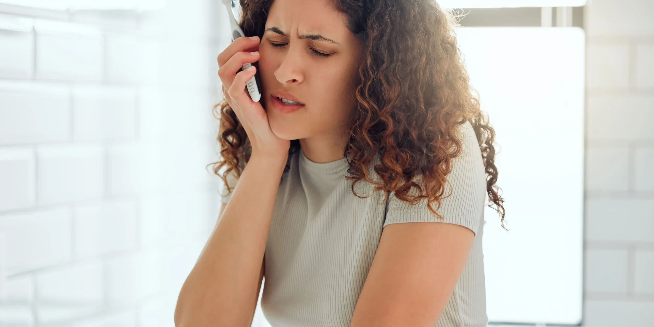 Ashgrove Dental – Gum Disease Pain from gum disease while brushing teeth